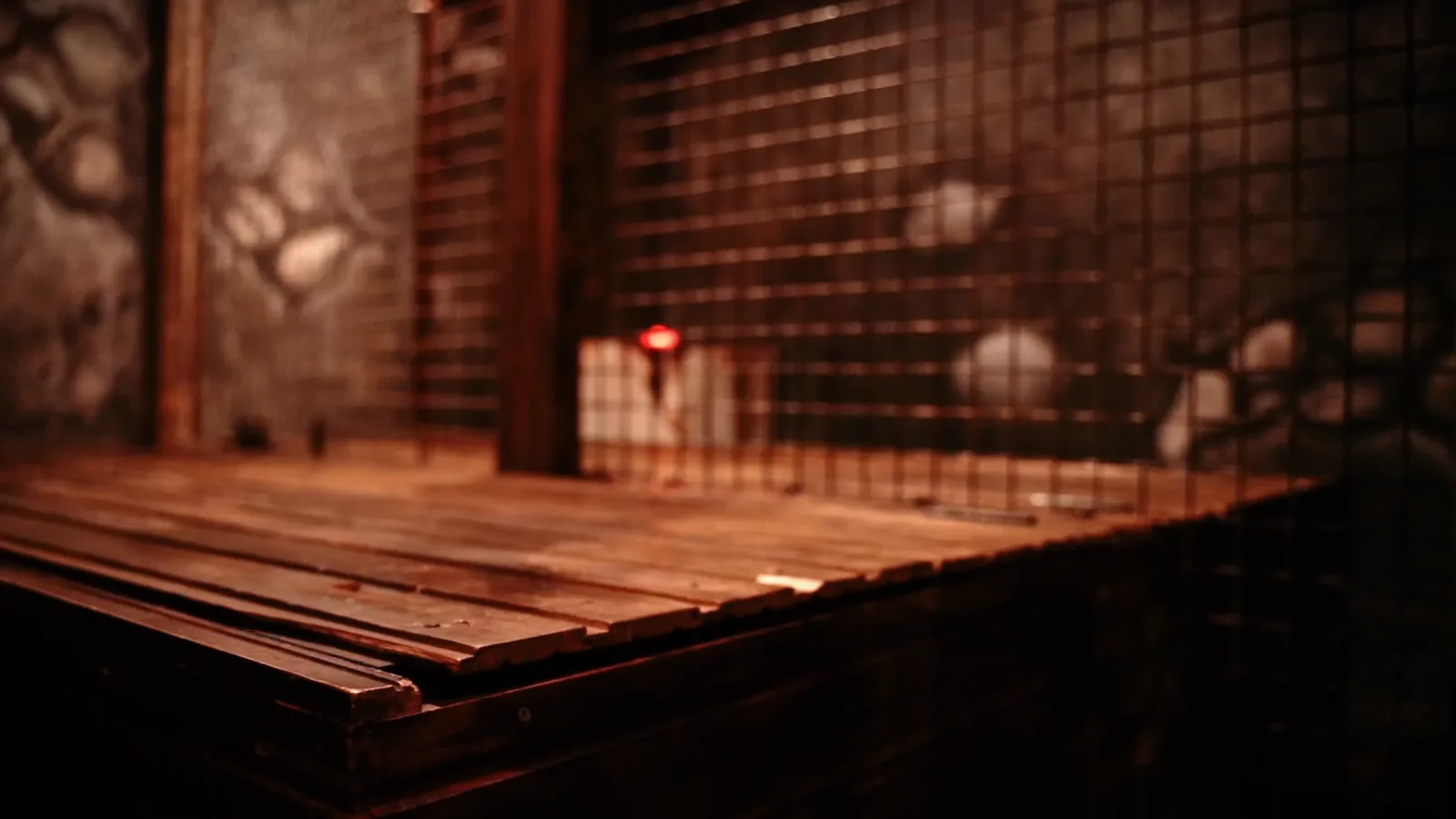 An open timber coffin lit red in the Buried Alive escape room